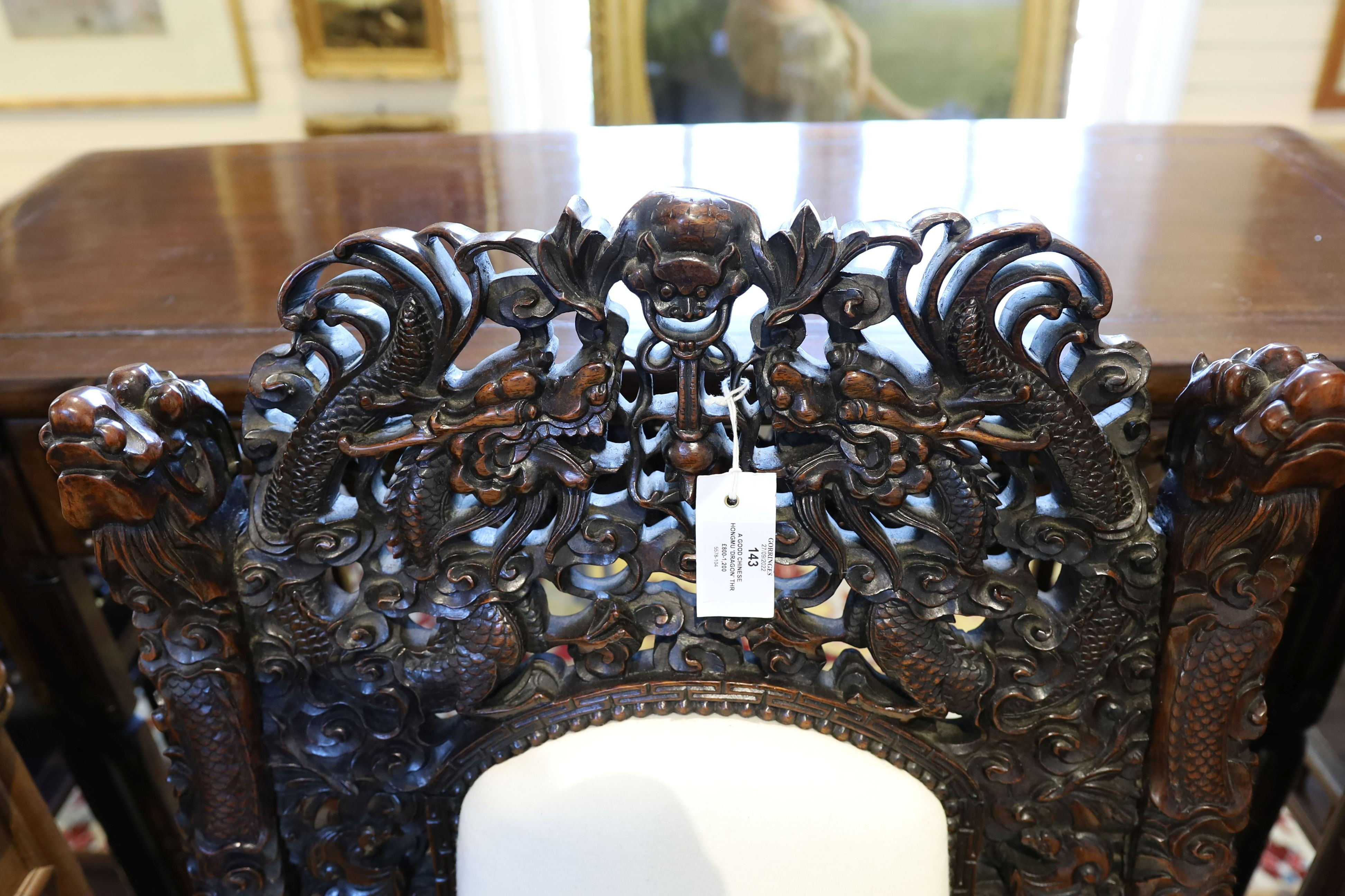 A good Chinese hardwood ‘dragon’ throne armchair, c.1900, 114.5cm high, 68cm wide at the arms